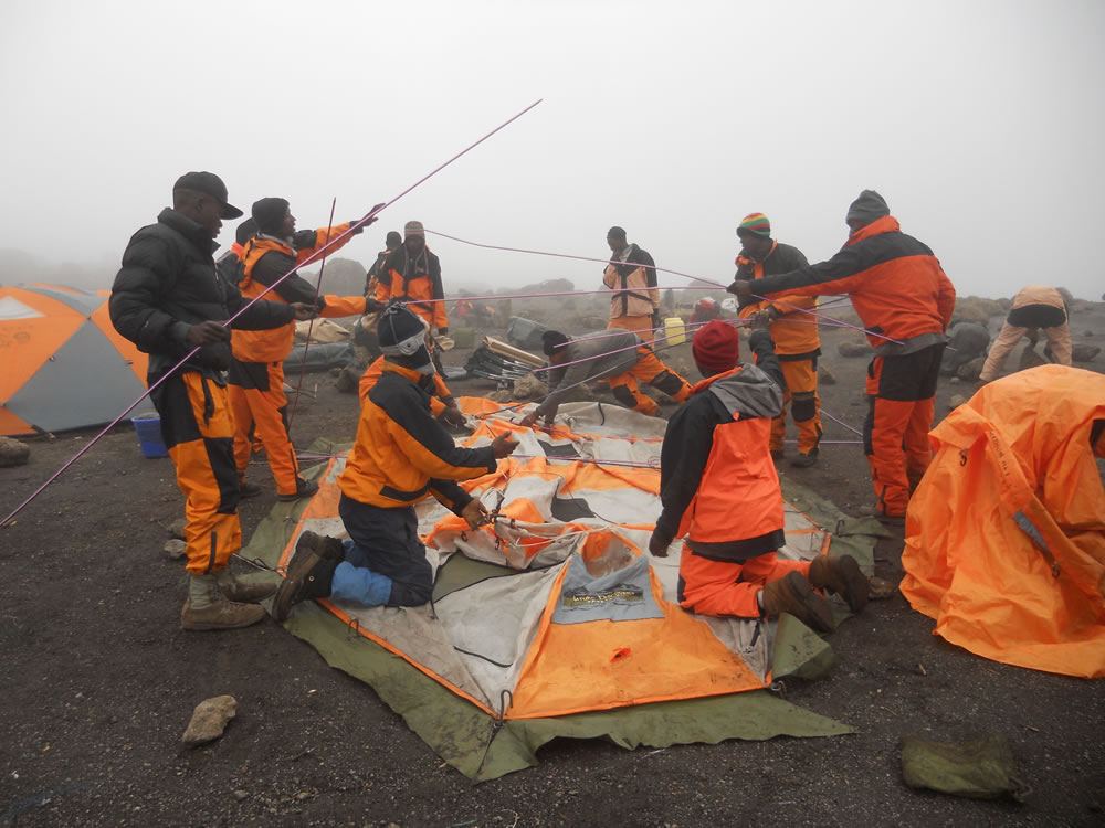 Our crew setting up the dining tent upon reaching camp