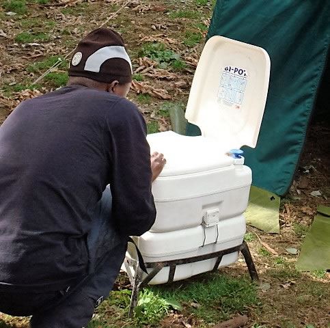 portable flush toilets managed by a trained sanitary services crew